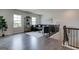 Spacious living room area featuring hardwood floors, large windows, and modern furnishings at 313 Westfall Ter # 225A, Loganville, GA 30052