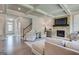 Open living room with fireplace, neutral decor, and hardwood floors, perfect for entertaining at 313 Westfall Ter # 225A, Loganville, GA 30052