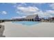 Community pool with ample deck space and a covered gathering area in a new home community on a sunny day at 313 Westfall Ter # 225A, Loganville, GA 30052