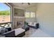 Cozy sunroom with a brick fireplace and comfortable seating at 313 Westfall Ter # 225A, Loganville, GA 30052