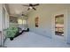 Covered sunroom includes ceiling fans and comfortable seating to enjoy the outdoors at 313 Westfall Ter # 225A, Loganville, GA 30052