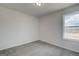 Neutral bedroom featuring carpet floors and a window for natural light at 605 Somerset Ct # 161A, Loganville, GA 30052