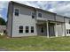 Backyard with gray siding, a covered patio, and a grassy lawn at 504 Clayborne Way # 248A, Loganville, GA 30052