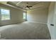 Spacious carpeted bedroom with tray ceilings, large windows, and natural light at 504 Clayborne Way # 248A, Loganville, GA 30052