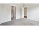 Bedroom featuring neutral walls and carpet, adjacent doors lead to a closet and another room at 504 Clayborne Way # 248A, Loganville, GA 30052