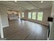 Expansive living room with abundant natural light, fireplace, and an open layout concept at 504 Clayborne Way # 248A, Loganville, GA 30052