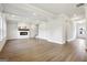 Bright and spacious living room with hardwood floors, fireplace, and abundant natural light at 504 Clayborne Way # 248A, Loganville, GA 30052