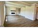 Spacious living room featuring wood floors, recessed lighting and electric fireplace at 504 Clayborne Way # 248A, Loganville, GA 30052