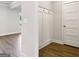 A well-designed mudroom with hooks, leading to the main living area with beautiful laminate flooring at 504 Clayborne Way # 248A, Loganville, GA 30052