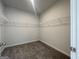 Walk-in closet featuring carpeted flooring, and built-in wire shelving at 504 Clayborne Way # 248A, Loganville, GA 30052