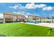 Beautiful backyard with lush green grass, a sparkling pool, and outdoor recreational areas at 209 Osier Dr, Mcdonough, GA 30252