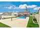 Spacious backyard featuring a basketball court, pool, and manicured landscaping at 209 Osier Dr, Mcdonough, GA 30252