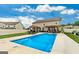 Gorgeous backyard featuring a pool, lounge chairs, and covered outdoor dining area at 209 Osier Dr, Mcdonough, GA 30252