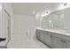 Modern bathroom showcasing dual sinks, a large mirror, stylish tile, and a glass shower at 209 Osier Dr, Mcdonough, GA 30252