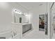 Elegant bathroom design with tub, dual vanity, large mirror and walk-in shower at 209 Osier Dr, Mcdonough, GA 30252