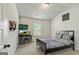Bedroom with wall mounted TVs and a bed at 209 Osier Dr, Mcdonough, GA 30252
