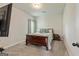 Cozy bedroom with a sleigh bed, carpet flooring, and soft natural lighting at 209 Osier Dr, Mcdonough, GA 30252