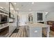 Modern kitchen with granite countertops, stainless steel appliances, and a center island at 209 Osier Dr, Mcdonough, GA 30252