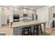Bright kitchen featuring a large island, granite counters, and stainless appliances at 209 Osier Dr, Mcdonough, GA 30252