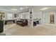 Open loft area with a leather couch, pool table, and comic book decor at 209 Osier Dr, Mcdonough, GA 30252