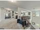 Upstairs entertainment area featuring a staircase, and doorway to an exercise room at 209 Osier Dr, Mcdonough, GA 30252
