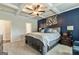 Elegant main bedroom features a coffered ceiling, accent wall, and a king-size bed at 209 Osier Dr, Mcdonough, GA 30252