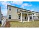 Exterior of home with lawn and covered back porch with white columns at 714 Bristol Dr # 279A, Loganville, GA 30052