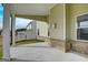 Covered porch with view of yard and neighboring houses at 714 Bristol Dr # 279A, Loganville, GA 30052