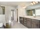 This bathroom features double sinks, tile floors, a shower, and a large mirror at 714 Bristol Dr # 279A, Loganville, GA 30052