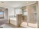 This bathroom includes a glass-enclosed shower and soaking tub at 714 Bristol Dr # 279A, Loganville, GA 30052
