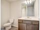 Bathroom features gray vanity with white countertop, wood-look flooring, and toilet at 714 Bristol Dr # 279A, Loganville, GA 30052