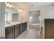 This bathroom includes double sinks, tile floors, a large mirror, and a glass-enclosed shower at 714 Bristol Dr # 279A, Loganville, GA 30052