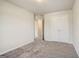 Bedroom with neutral gray carpet, white walls and doors, and an attached closet at 714 Bristol Dr # 279A, Loganville, GA 30052