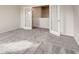 Bedroom features neutral gray carpet, white walls and doors, and french doors to a closet at 714 Bristol Dr # 279A, Loganville, GA 30052