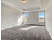 This bedroom has two large windows for plenty of natural light and soft carpet at 714 Bristol Dr # 279A, Loganville, GA 30052