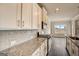 Modern kitchen featuring granite countertops, subway tile backsplash, and stainless appliances at 714 Bristol Dr # 279A, Loganville, GA 30052