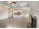 Open-concept kitchen and living room with coffered ceilings and a cozy fireplace at 714 Bristol Dr # 279A, Loganville, GA 30052