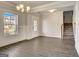 Open-concept living room features hardwood floors, wainscoting, and ample natural light at 714 Bristol Dr # 279A, Loganville, GA 30052