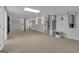 Unfinished basement featuring neutral carpet, gray walls, support beams, and mechanicals at 81 Bowers Rd, Moreland, GA 30259