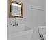 Utility bathroom featuring a white utility sink, mirror, and toilet at 81 Bowers Rd, Moreland, GA 30259