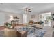 Open living space features hardwood floors, a comfortable sofa, and stylish decor, creating a welcoming and airy atmosphere at 81 Bowers Rd, Moreland, GA 30259