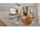 Inviting living room featuring a brick fireplace, ceiling fan, and comfortable seating arrangement, creating a cozy atmosphere at 81 Bowers Rd, Moreland, GA 30259