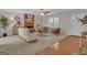 Sunlit living room with brick fireplace and hardwood flooring offers comfort and style at 81 Bowers Rd, Moreland, GA 30259