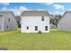 A home's backyard features a well-manicured lawn and easy access to neighboring properties at 100 Avondale Blvd, Conyers, GA 30013