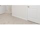 Hallway with neutral carpeting, white doors, and base trim at 100 Avondale Blvd, Conyers, GA 30013