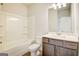 Bathroom with a bathtub, tile floor and vanity with wood cabinets at 404 Westmarch Cir # 284A, Loganville, GA 30052