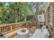 Relaxing outdoor deck featuring wood railings and a cozy seating area with a stylish outdoor table at 1718 Ridgewood Ne Dr, Atlanta, GA 30307