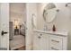 Clean bathroom featuring a white vanity with a marble countertop and brushed nickel faucet, offering a sleek design at 1718 Ridgewood Ne Dr, Atlanta, GA 30307