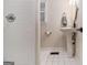Bright bathroom featuring subway tile, a pedestal sink, and modern fixtures, offering a clean and sleek design at 1718 Ridgewood Ne Dr, Atlanta, GA 30307