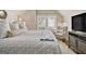 Comfortable bedroom featuring neutral tones, natural lighting, and a sitting area at 1718 Ridgewood Ne Dr, Atlanta, GA 30307